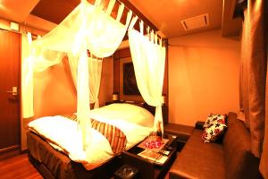 Кровать или кровати в номере Hotel Balian Resort Higashi Shinjuku (Adult Only)