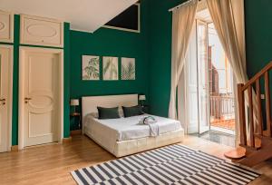 Ένα ή περισσότερα κρεβάτια σε δωμάτιο στο B&B Ruffo di Bagnara Palazzo Monumentale