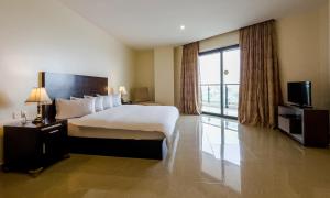 Katil atau katil-katil dalam bilik di Black Diamond Hotel