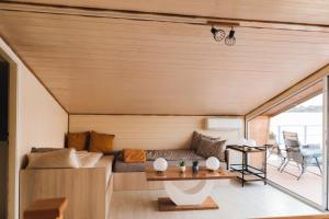 a living room with a couch and a table at Splav Nala in Belgrade