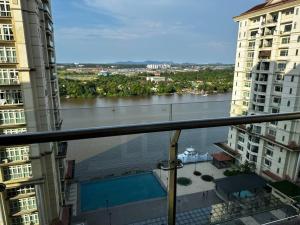a view of a river from the balcony of a building at A.R Homestay Riverine Condominium (Riverview)(A) in Kuching