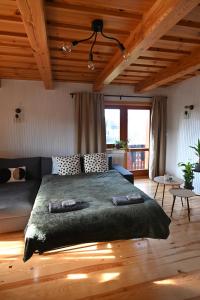 Postel nebo postele na pokoji v ubytování Apartmán s krbom vedľa Zubačky