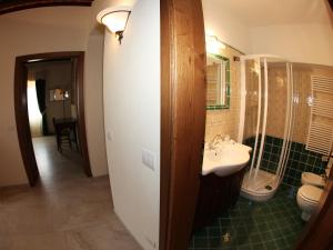 a bathroom with a sink and a toilet at Villa Alba in Marciana Marina