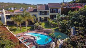 an aerial view of a house with a swimming pool at Gästehaus Pinkepank in Plettenberg Bay