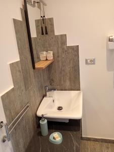 a bathroom with a sink and a mirror at Casa Vacanze MURANUM - B&B in Morano Calabro +55 photos