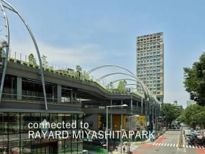 a building with a sign that reads connected to rayaamd myxshawap at sequence MIYASHITA PARK - Shibuya in Tokyo