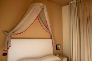 Postel nebo postele na pokoji v ubytování Masseria Olivola