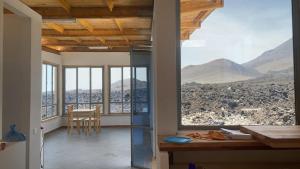 a kitchen with a view of a mountain at Casa Adriano & Filomena Montrond in Portela
