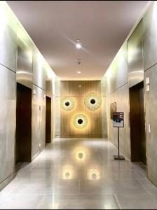 a hallway of a building with a painting on the wall at Aeon Towers Condotel in Davao City