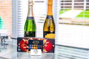 two bottles of wine in a box on a table at Birmingham Near Airports & NEC, Contractors & Leisure Stays Property Retreat Short Lets & Serviced Accommodation in Kingshurst