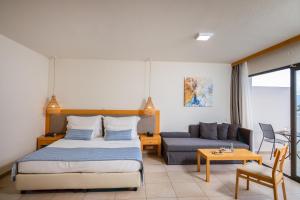 Кровать или кровати в номере Ariadne Beach - Adults Only