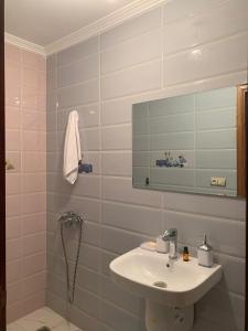 a bathroom with a sink and a mirror at appartement équipé in Tangier