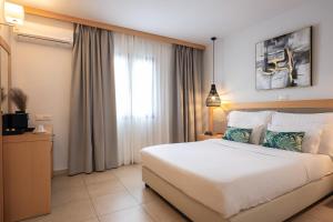 Кровать или кровати в номере Ariadne Beach - Adults Only