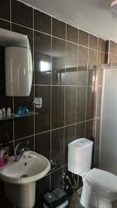 Ein Badezimmer in der Unterkunft AQQA RESİDANCE