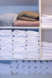 a closet filled with lots of white towels at Konačište Zaplanjsko ognjište 