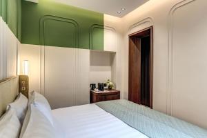 Ένα ή περισσότερα κρεβάτια σε δωμάτιο στο THE STEPS Hotel - by Eitch Collection