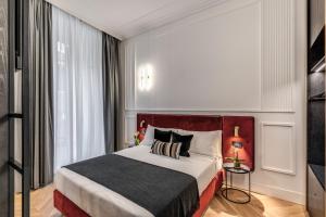 Residenza Piranesi Boutique Hotel客房内的一张或多张床位