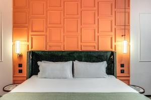 Ένα ή περισσότερα κρεβάτια σε δωμάτιο στο THE STEPS Hotel - by Eitch Collection