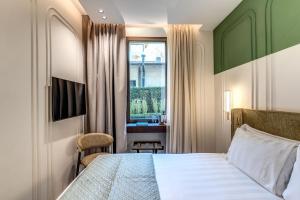 Ένα ή περισσότερα κρεβάτια σε δωμάτιο στο THE STEPS Hotel - by Eitch Collection