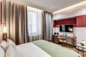 Ένα ή περισσότερα κρεβάτια σε δωμάτιο στο THE STEPS Hotel - by Eitch Collection
