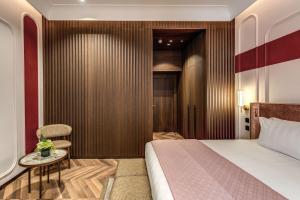 Ένα ή περισσότερα κρεβάτια σε δωμάτιο στο THE STEPS Hotel - by Eitch Collection