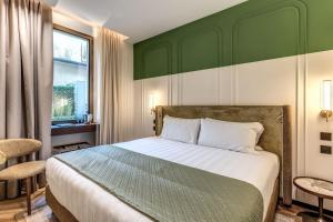 Ένα ή περισσότερα κρεβάτια σε δωμάτιο στο THE STEPS Hotel - by Eitch Collection