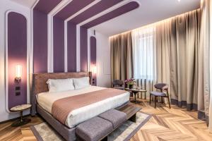 Ένα ή περισσότερα κρεβάτια σε δωμάτιο στο THE STEPS Hotel - by Eitch Collection