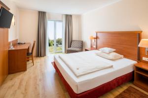 Postel nebo postele na pokoji v ubytování Hotel Meridian ***superior