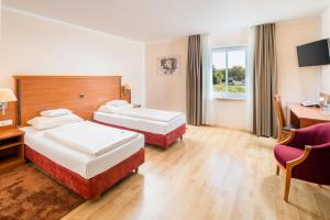 Postel nebo postele na pokoji v ubytování Hotel Meridian ***superior