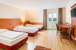 Postel nebo postele na pokoji v ubytování Hotel Meridian ***superior