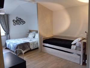 Postel nebo postele na pokoji v ubytování Homgaïa chambres d'hôtes