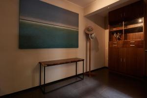 a room with a table and a chalkboard on the wall at Las Privadas / Casa X By Nardazul in Oaxaca City