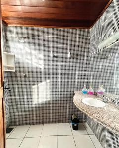 a bathroom with a sink and a shower at AL EVENTOS in Teresina