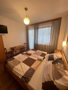 Postel nebo postele na pokoji v ubytování Pension Strasser