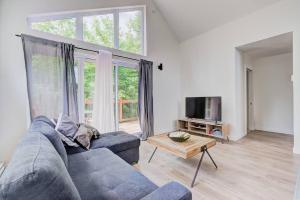 TV a/nebo společenská místnost v ubytování Nouveau - Chalet moderne - Spa, piscine & sauna!