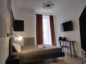 TV a/nebo společenská místnost v ubytování MATTEOTTI ROOMS