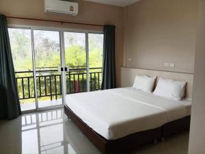 Tempat tidur dalam kamar di Chiangdaoplace