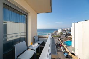 a balcony with a view of the ocean at Nafsika Hotel in Rhodes Town