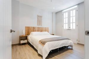 Krevet ili kreveti u jedinici u objektu Casa Love 1C - Acogedor y moderno apartamento de 1Hab en Casco Antiguo