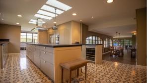 a large kitchen with a island and a dining room at Can Estrelles Luxury Villa in Mont Barbat