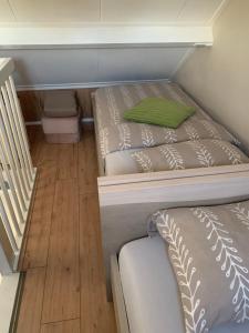 two bunk beds in a room with a wooden floor at At MarRies in Wilp