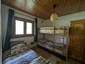 Voodi või voodid majutusasutuse Chalet Cactus - 4 Vallées toas +19 fotot