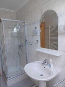 a bathroom with a sink and a shower and a sink at Appartement Panorama in Gröbming +33 photos