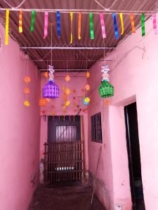 a room with colorful lights hanging from a building at 224 in Oaxaca City