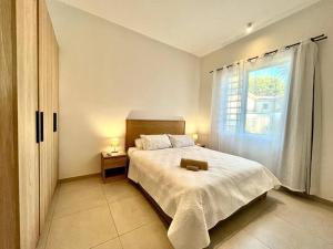 A Beachfront Haven - Ocean Point B2客房内的一张或多张床位