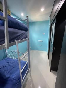 a room with two bunk beds and a hallway at GazStation in Kata Beach