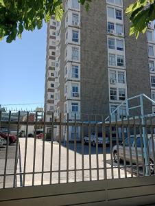 a bus parked in front of a tall building at La casa de Emma in Cordoba +21 photos