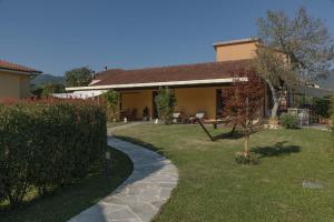 a house with a garden and a walkway at CàMia Lovely house ValDiVara 5Terre hiking in Sesta Godano