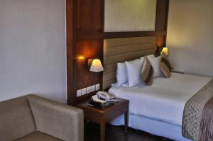 Postel nebo postele na pokoji v ubytování Hotel Smart Stay