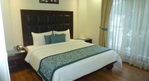 Postel nebo postele na pokoji v ubytování Hotel Smart Stay